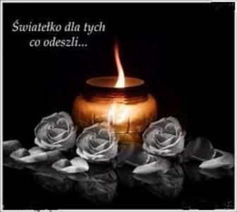 Zdjęcie przedstawia płonący znicz.