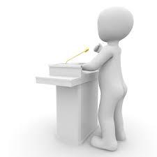 rysunek człowiek przy mównicy